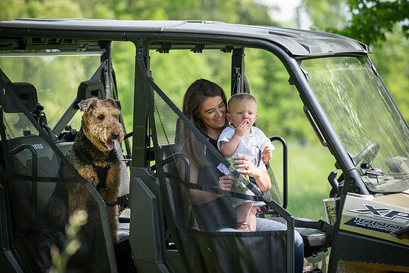 Family watching Micah fishing ponds
